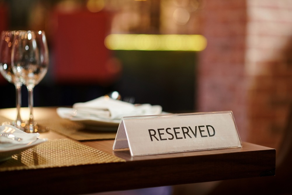reserved sign on restaurant dining table